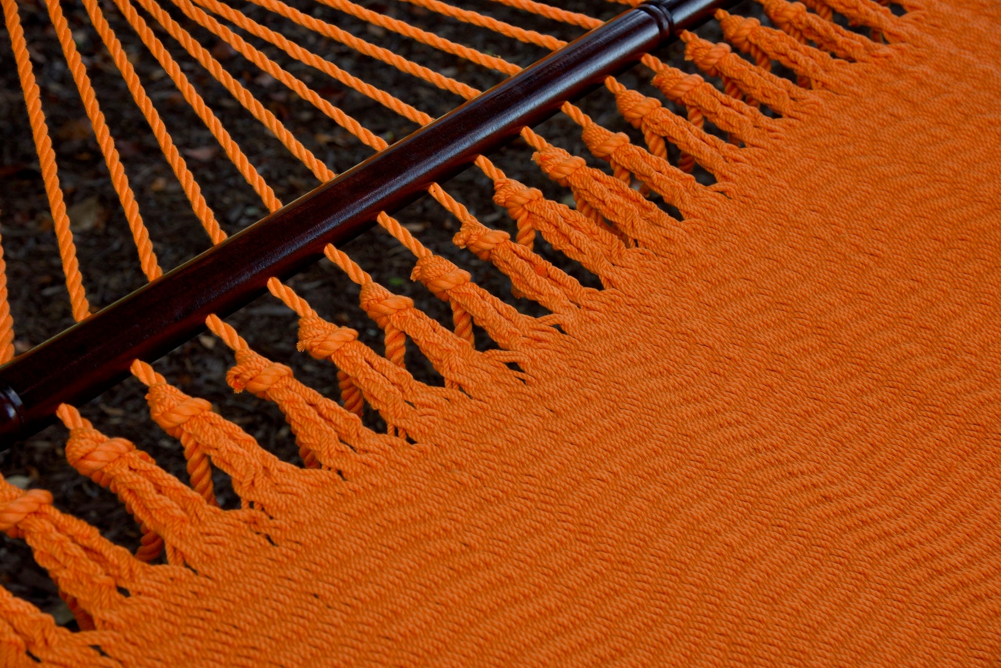 Close-up of the knotted edge loops joining the end cords to the bed of the Orange Jumbo Caribbean Hammock