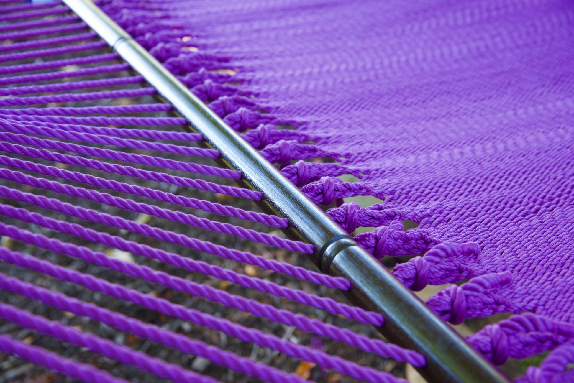 Macro view of the knotted edge loops at the spreader bar of the Purple Jumbo Caribbean Hammock