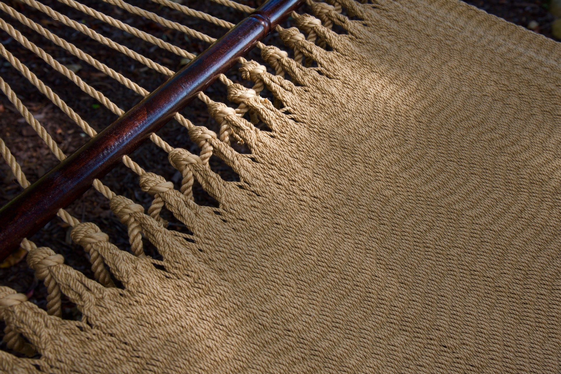 Close-up of the knotted edge loops joining the end cords to the bed of the Tan Jumbo Caribbean Hammock