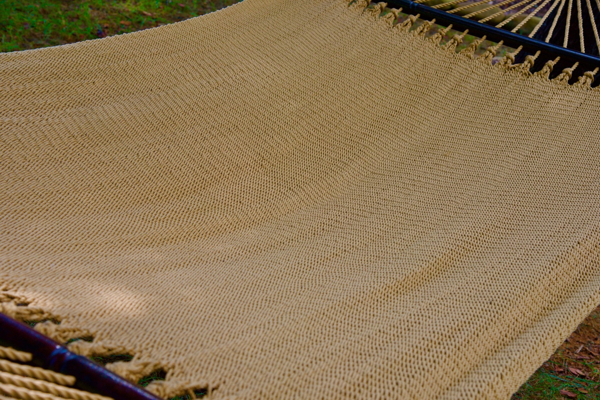 The full hand-woven bed of the Tan Jumbo Caribbean Hammock seen end to end
