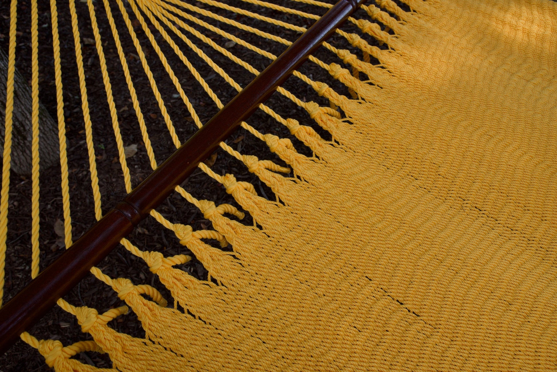 Close-up of the knotted edge loops joining the end cords to the bed of the Yellow Jumbo Caribbean Hammock