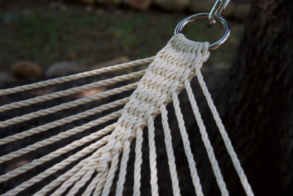 Close view of the O-ring and gathered Cream end cords of the Jumbo Rope Hammock.
