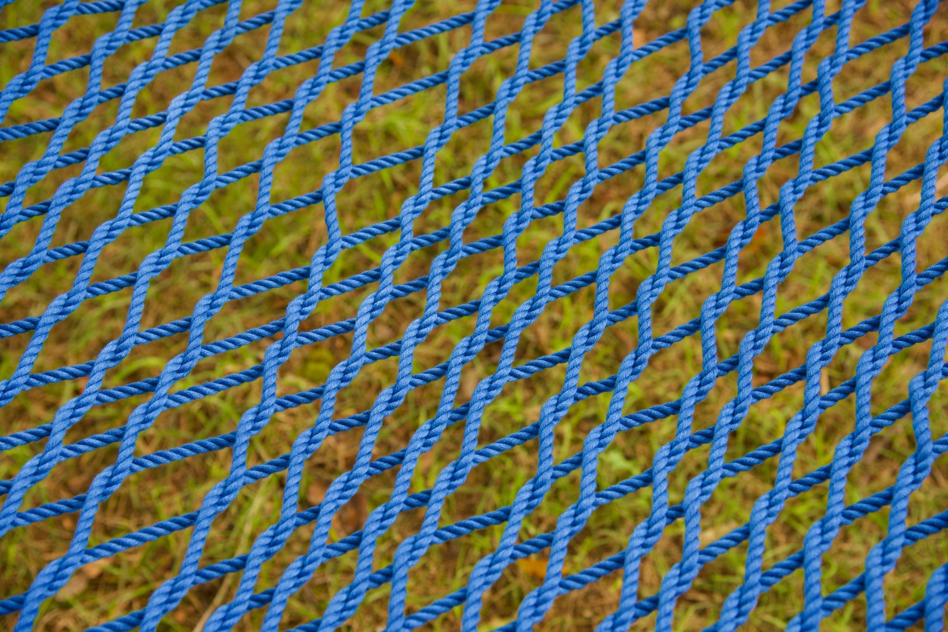 Close view of the hand-woven Dark Blue soft-spun polyester rope weave of the Jumbo Rope Hammock.