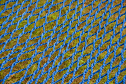 Close view of the hand-woven Dark Blue soft-spun polyester rope weave of the Jumbo Rope Hammock.