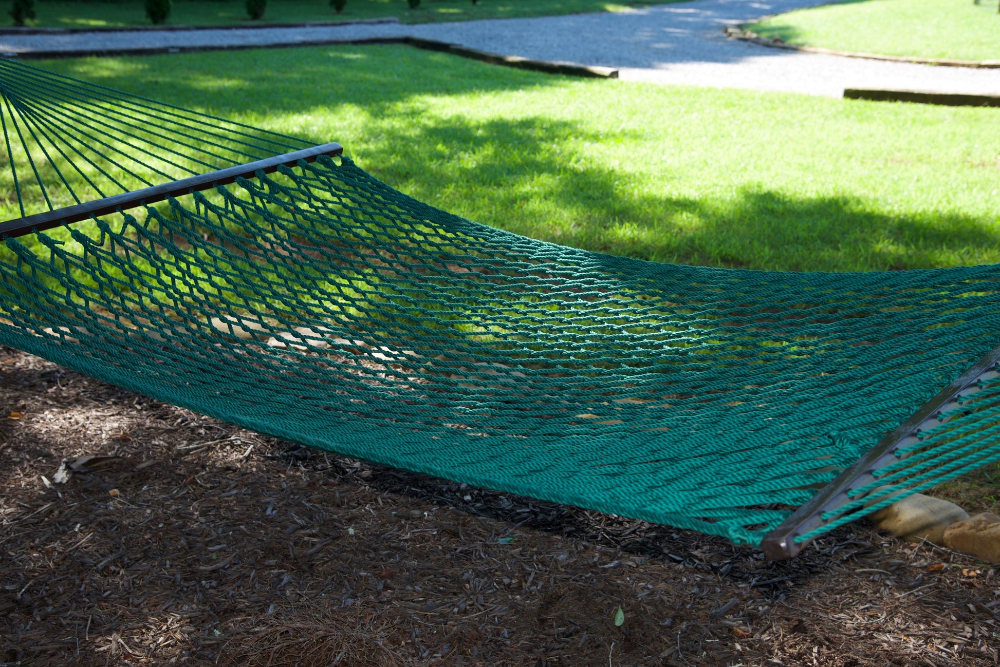 Close view of the Green polyester rope bed and wood spreader bar of the Jumbo Rope Hammock.