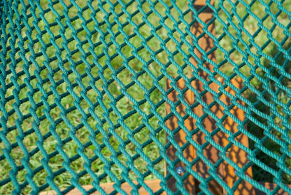 Close view of the hand-woven Green soft-spun polyester rope weave of the Jumbo Rope Hammock.