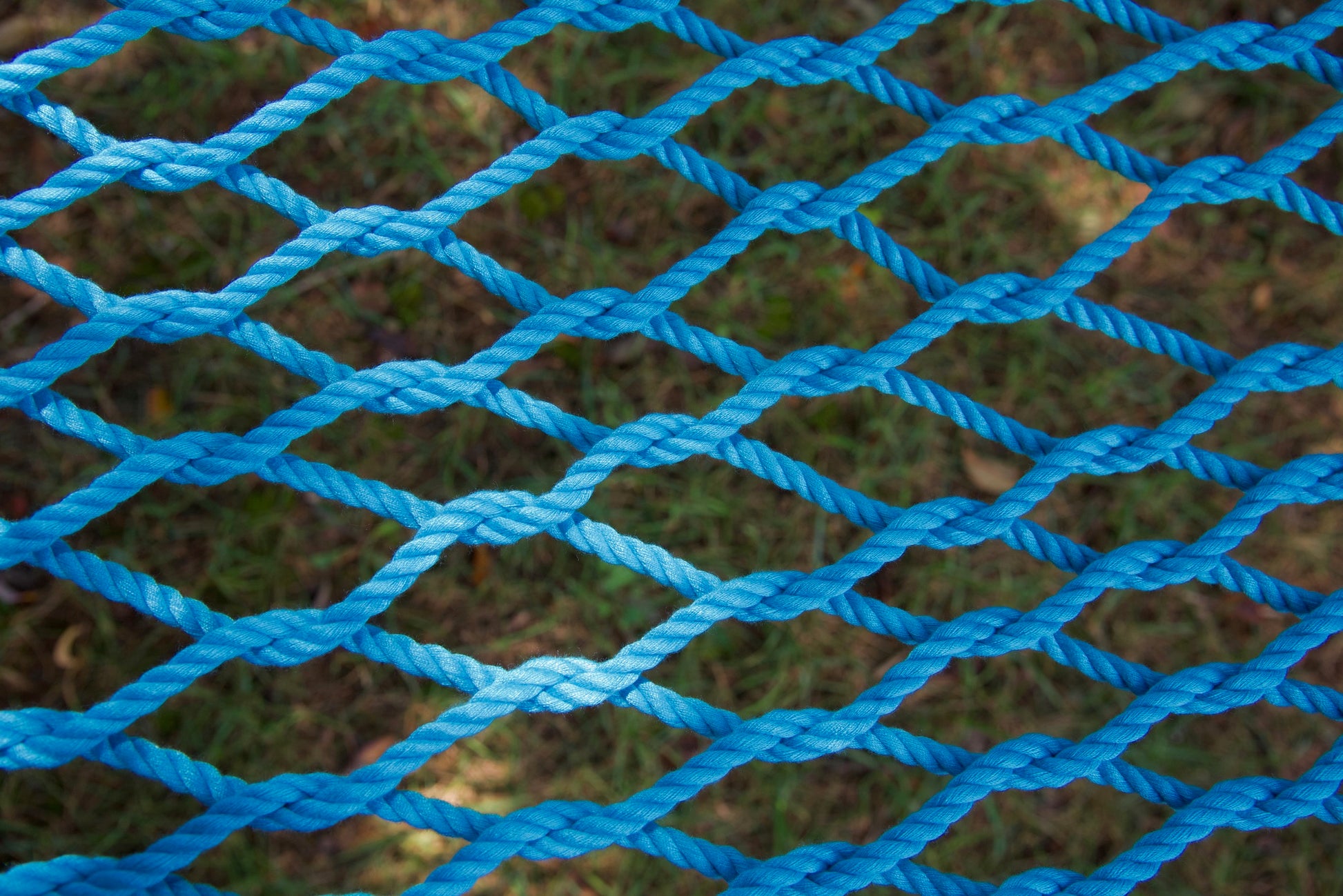 Close view of the hand-woven Light Blue soft-spun polyester rope weave of the Jumbo Rope Hammock.