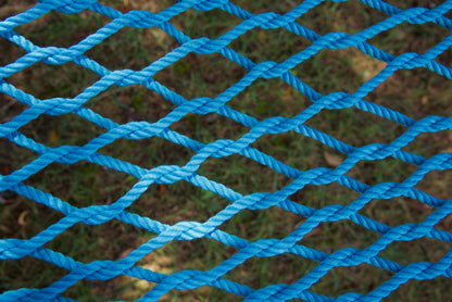 Close view of the hand-woven Light Blue soft-spun polyester rope weave of the Jumbo Rope Hammock.