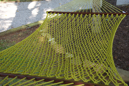 Close view of the Olive polyester rope bed and wood spreader bar of the Jumbo Rope Hammock.