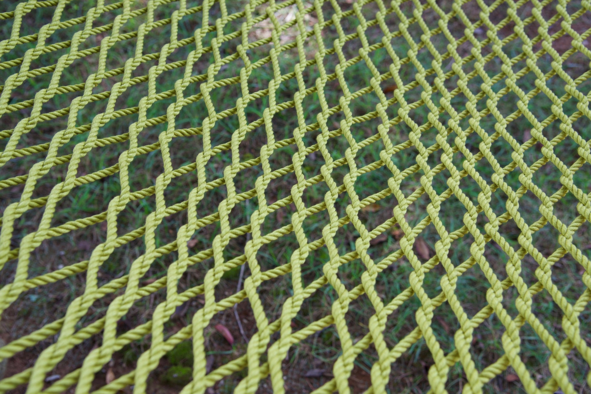 Close view of the hand-woven Olive soft-spun polyester rope weave of the Jumbo Rope Hammock.