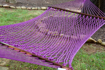 Close view of the Purple polyester rope bed and wood spreader bar of the Jumbo Rope Hammock.