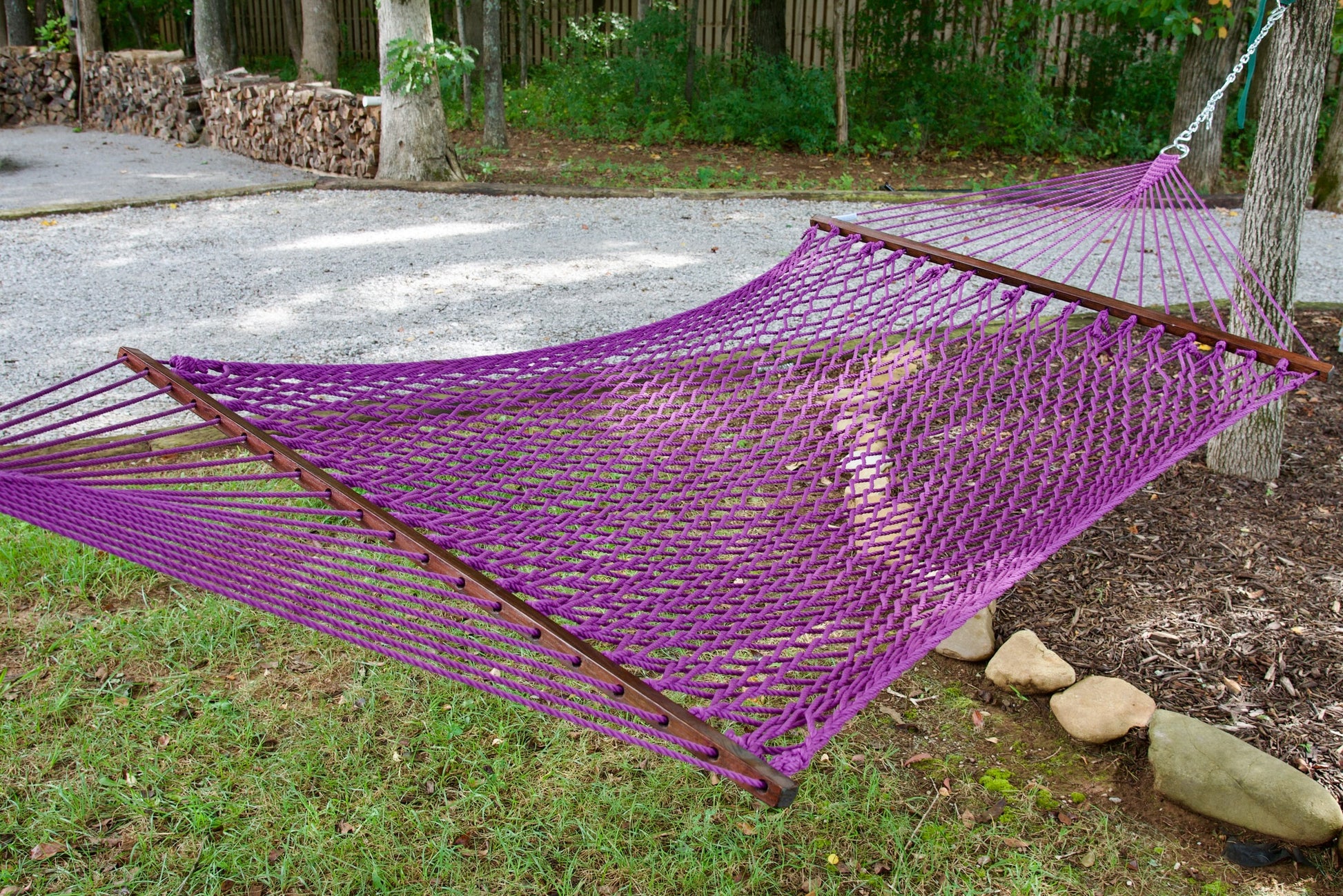 Close view of the Purple polyester rope bed and wood spreader bar of the Jumbo Rope Hammock.
