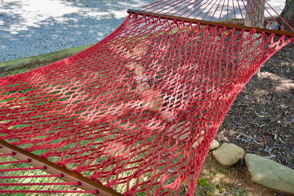 Close view of the Red polyester rope bed and wood spreader bar of the Jumbo Rope Hammock.
