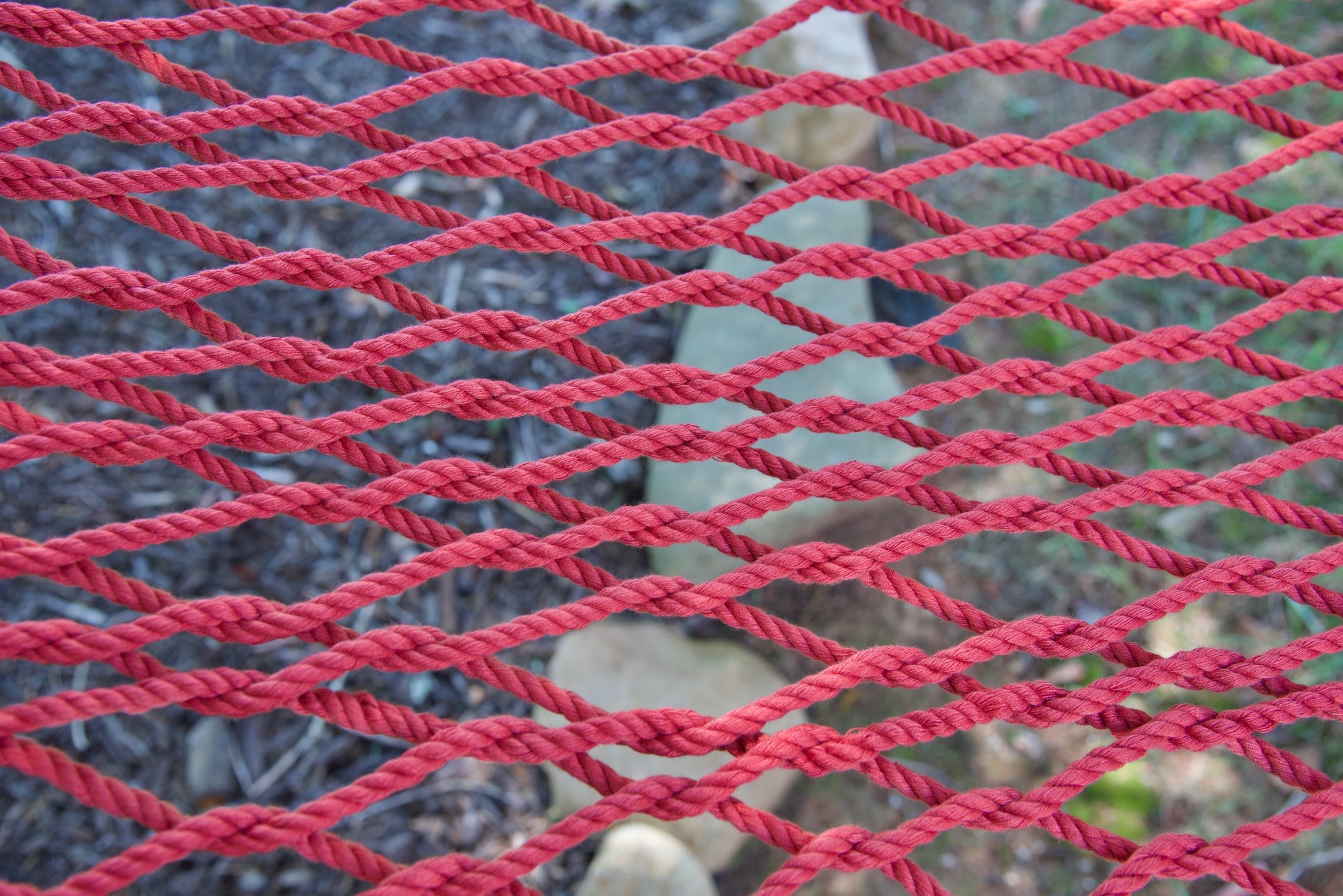 Close view of the hand-woven Red soft-spun polyester rope weave of the Jumbo Rope Hammock.