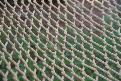 Close view of the hand-woven Tan soft-spun polyester rope weave of the Jumbo Rope Hammock.