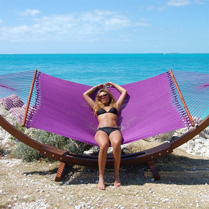 Woman laying in Jumbo Purple Hammock with Wooden Hammock Stand