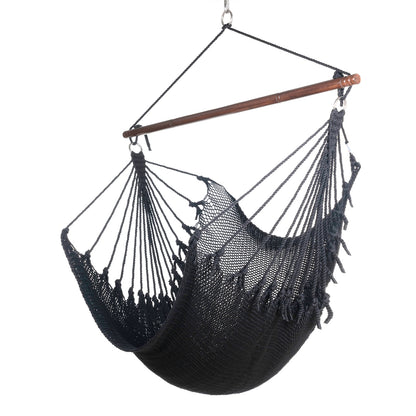 Jumbo Caribbean Hammock Chair in black, hand-woven polyester cord with a dark hardwood spreader bar and tasseled ends, on a white background