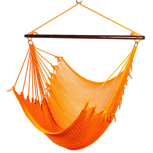 Jumbo Caribbean Hammock Chair in orange, hand-woven polyester cord with a dark hardwood spreader bar and tasseled ends, on a white background