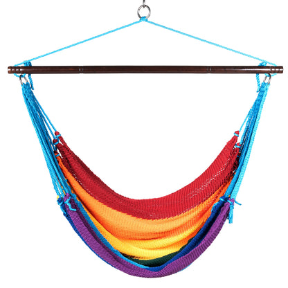 Front view of a rainbow Jumbo Caribbean Hammock Chair showing the deep woven seat and tasseled sides, on a white background