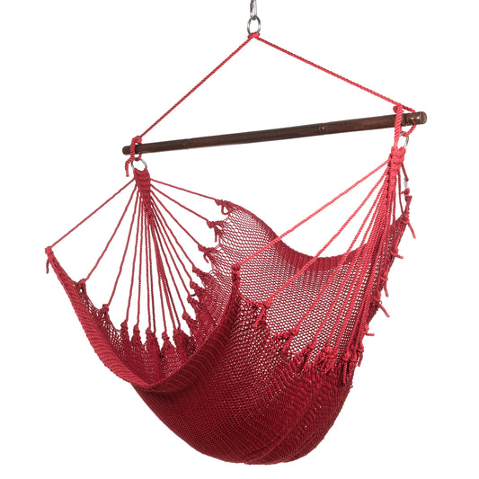 Jumbo Caribbean Hammock Chair in red, hand-woven polyester cord with a dark hardwood spreader bar and tasseled ends, on a white background