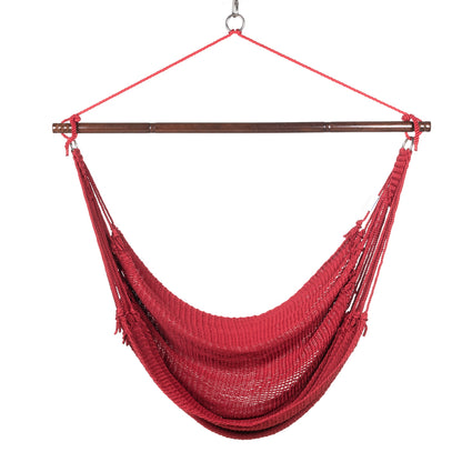 Front view of a red Jumbo Caribbean Hammock Chair showing the deep woven seat and tasseled sides, on a white background