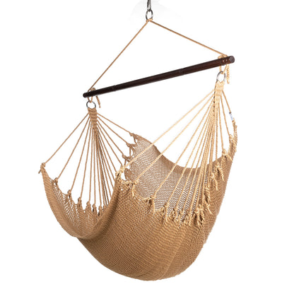 Jumbo Caribbean Hammock Chair in tan, hand-woven polyester cord with a dark hardwood spreader bar and tasseled ends, on a white background