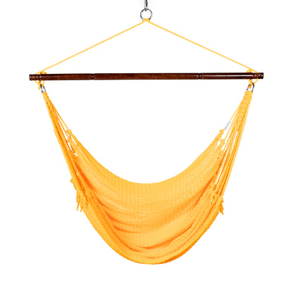 Front view of a yellow Jumbo Caribbean Hammock Chair showing the deep woven seat and tasseled sides, on a white background