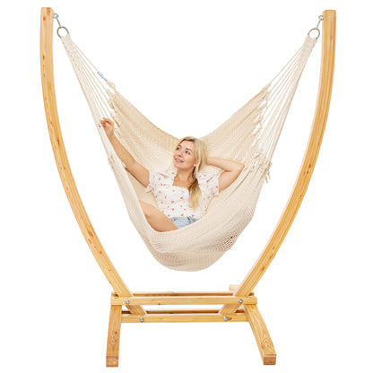 Cream Jumbo Caribbean Recliner on a Siberian larch wood arc stand, woman leaning back with arms behind the head