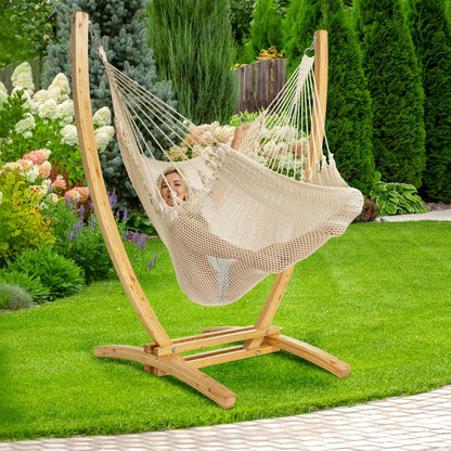 Cream Jumbo Caribbean Recliner on a wood arc stand in a backyard beside flowering hydrangeas