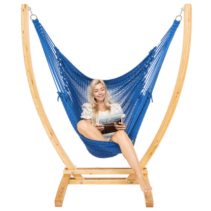 Dark Blue Jumbo Caribbean Recliner on a Siberian larch wood arc stand, woman seated with a tablet