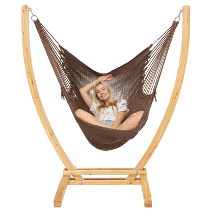 Mocha Jumbo Caribbean Recliner on a Siberian larch wood arc stand, woman leaning back with arms behind the head