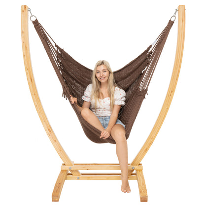 Mocha Jumbo Caribbean Recliner on a Siberian larch wood arc stand, woman seated upright, front view