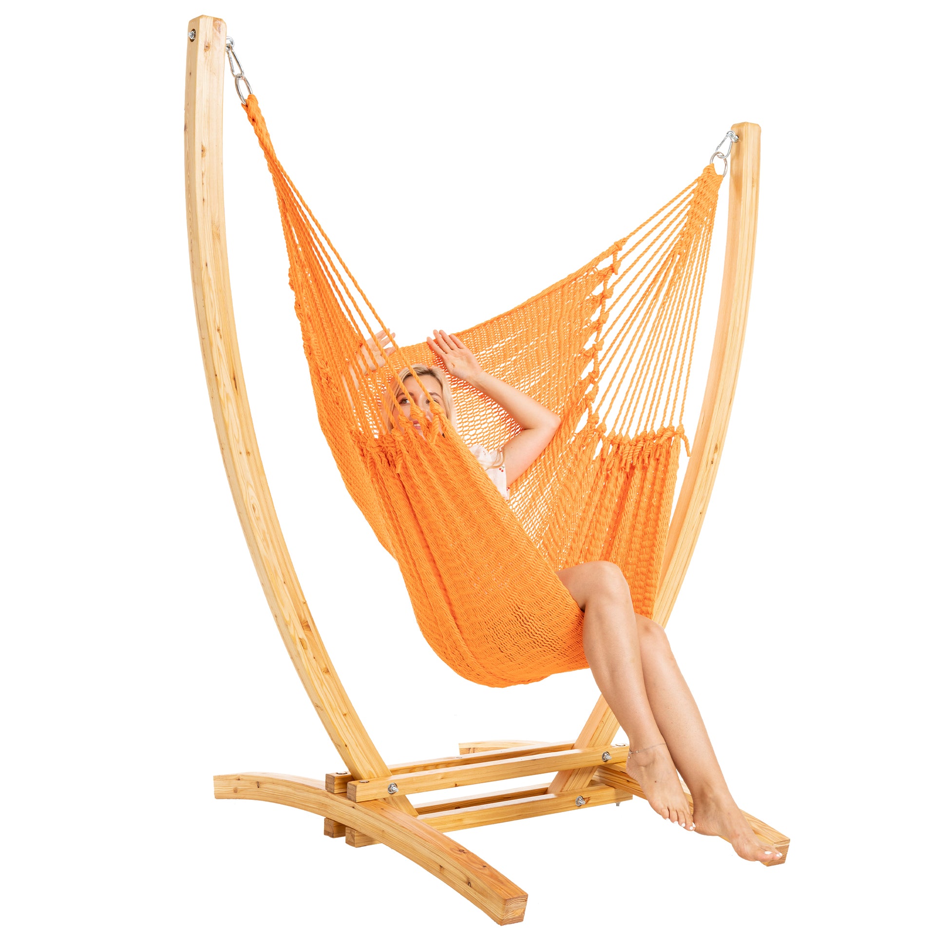 Orange Jumbo Caribbean Recliner on a Siberian larch wood arc stand, woman seated, three-quarter view