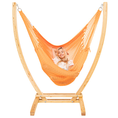 Orange Jumbo Caribbean Recliner on a Siberian larch wood arc stand, woman reclined full length