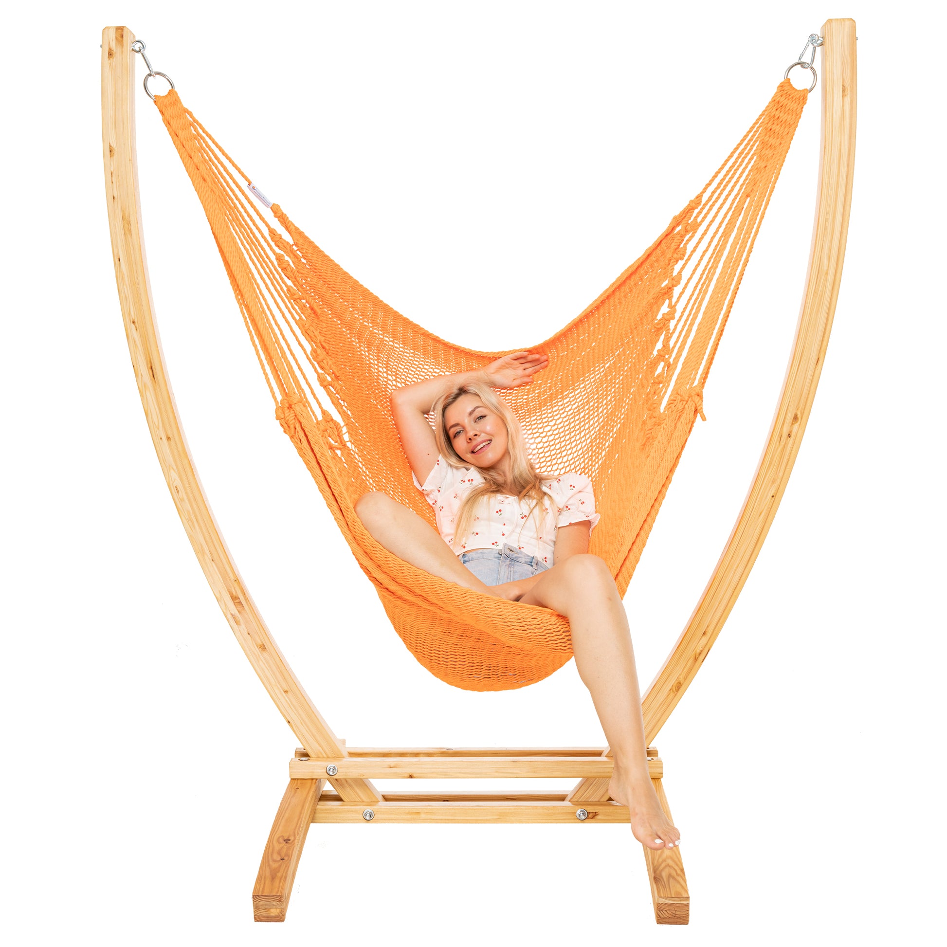 Orange Jumbo Caribbean Recliner on a Siberian larch wood arc stand, woman reclined with arms raised