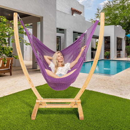 Purple Jumbo Caribbean Recliner on a wood arc stand beside a swimming pool