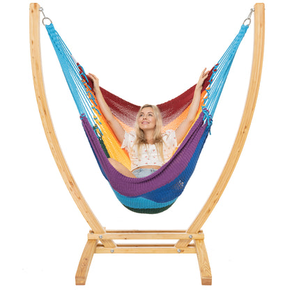 Rainbow Jumbo Caribbean Recliner on a Siberian larch wood arc stand, woman reclined full length