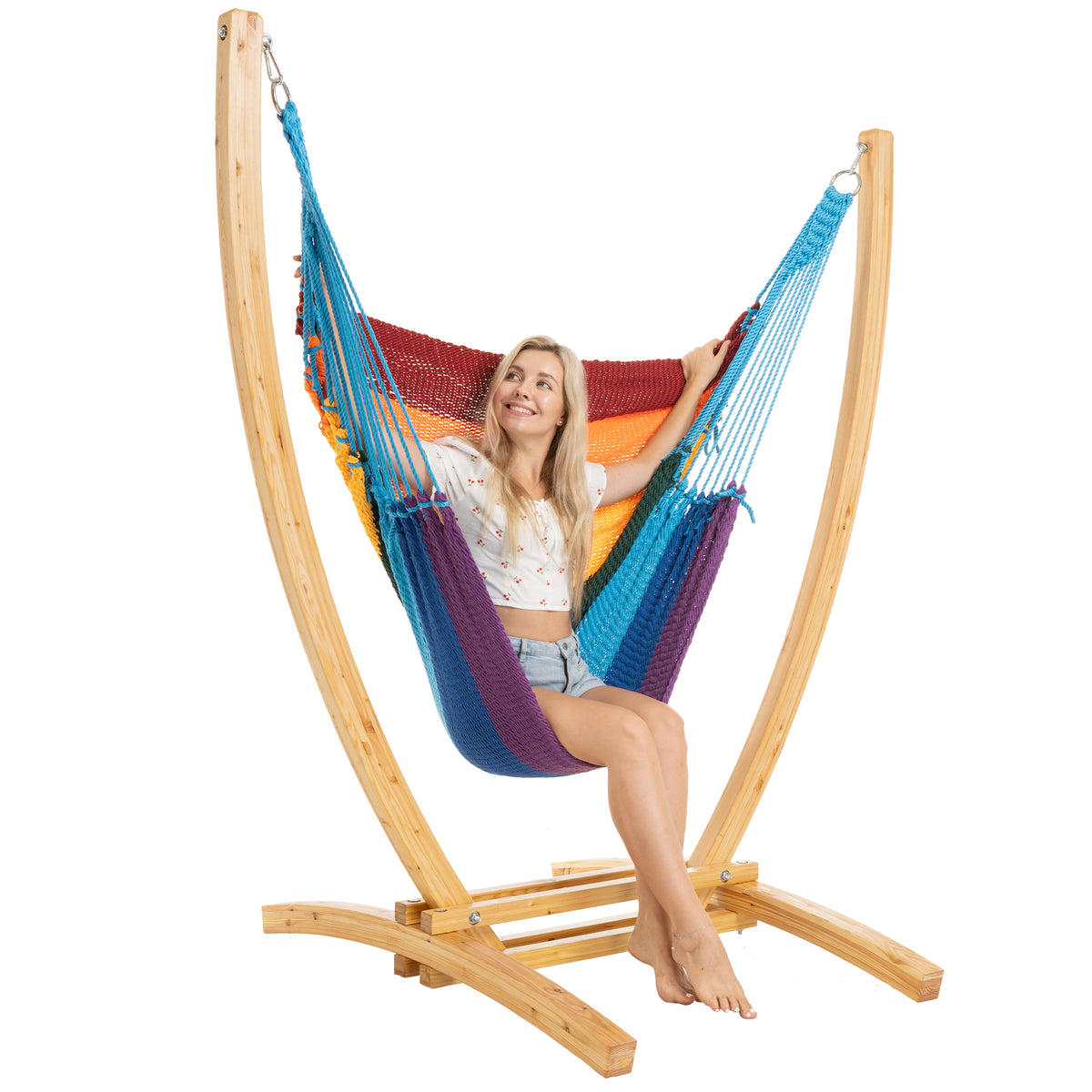 Rainbow Jumbo Caribbean Recliner on a Siberian larch wood arc stand, woman seated with a hand on the end cords