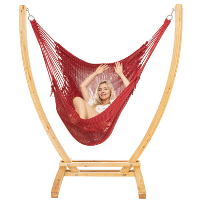 Red Jumbo Caribbean Recliner on a Siberian larch wood arc stand, woman reclined with arms raised
