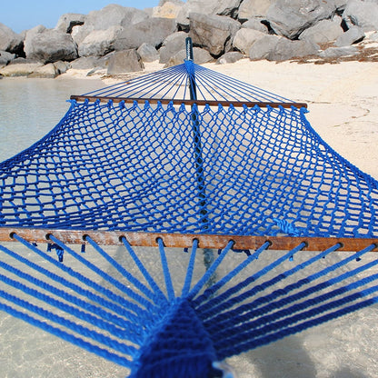 Dark Blue Jumbo Rope Hammock on a black Tri-Beam hammock stand at the water's edge.