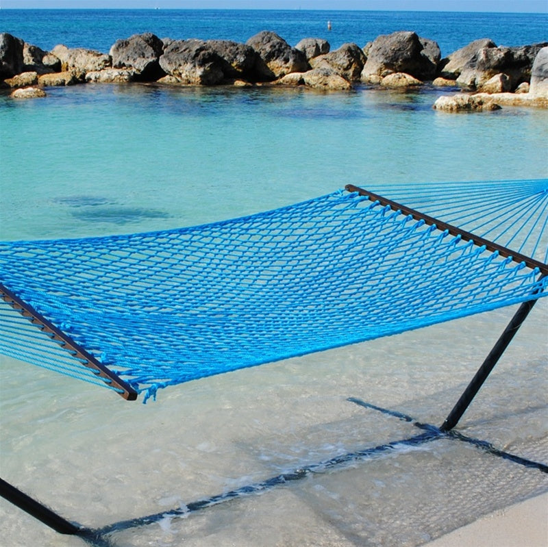 Light Blue Jumbo Rope Hammock on a black Tri-Beam hammock stand at the water's edge.
