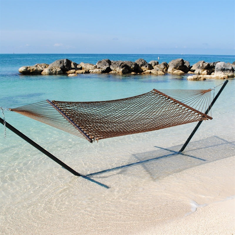 Mocha Jumbo Rope Hammock on a black Tri-Beam hammock stand at the water's edge.