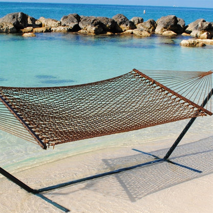 Mocha Jumbo Rope Hammock on a black Tri-Beam hammock stand at the water's edge.
