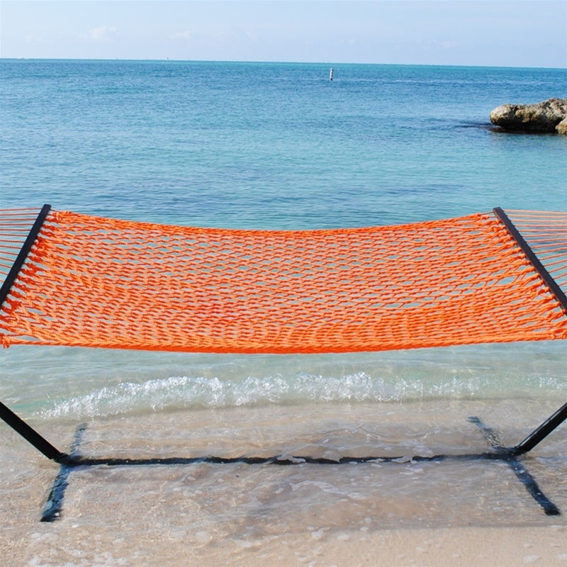 Orange Jumbo Rope Hammock on a black Tri-Beam hammock stand at the water's edge.