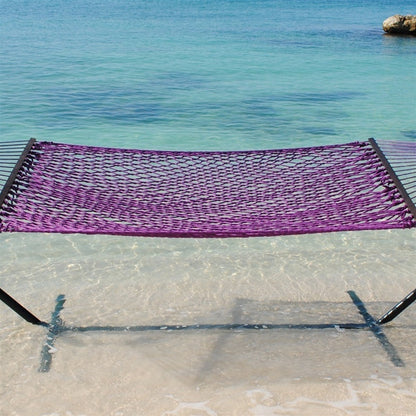 Purple Jumbo Rope Hammock on a black Tri-Beam hammock stand at the water's edge.