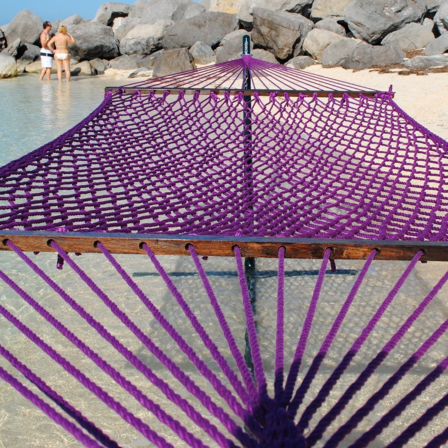 Purple Jumbo Rope Hammock on a black Tri-Beam hammock stand at the water's edge.