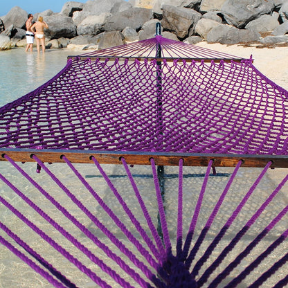 Purple Jumbo Rope Hammock on a black Tri-Beam hammock stand at the water's edge.