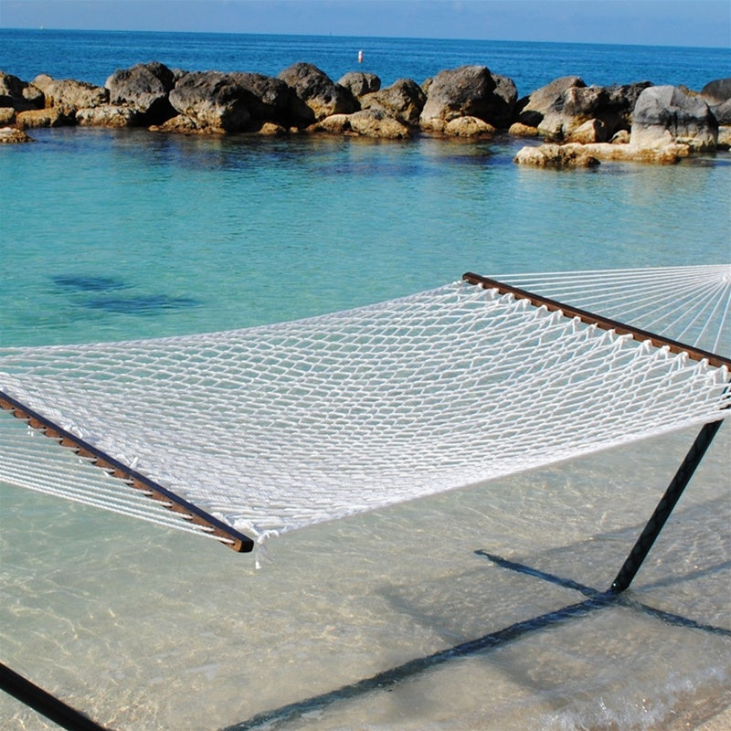 White Jumbo Rope Hammock on a black Tri-Beam hammock stand at the water's edge.