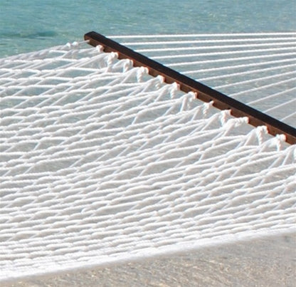White Jumbo Rope Hammock on a black Tri-Beam hammock stand at the water's edge.