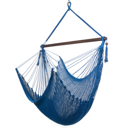 Large Caribbean Hammock Chair in dark blue, hand-woven polyester cord with a dark hardwood spreader bar and tasseled ends, on a white background